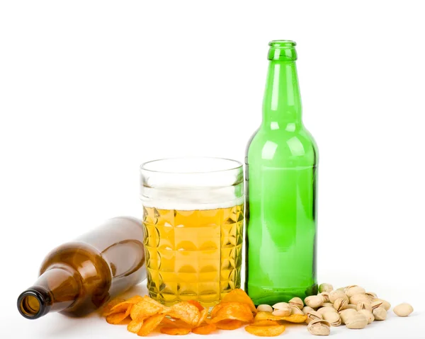 Potato chips and pistachios with beer on white — Stock Photo, Image