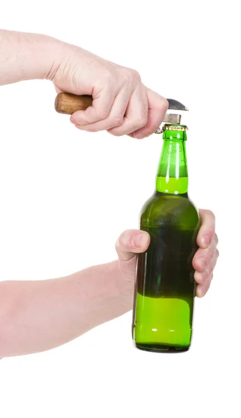 Hand met groene bierfles geïsoleerd op een witte — Stockfoto