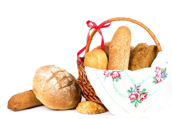Still-life with small loaf in basket — Stock Photo, Image