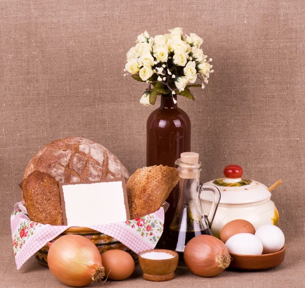 Still-life with small loaf in basket with banner add — Stock Photo, Image