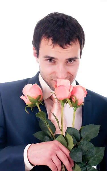 Valentines man met bloemen op witte achtergrond — Stockfoto