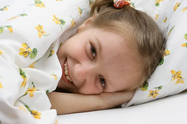 Child girl at the bed — Stock Photo, Image