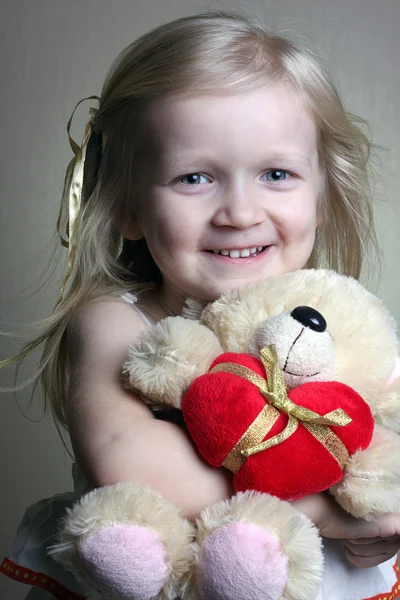 Girl with toy bear — Stock Photo, Image