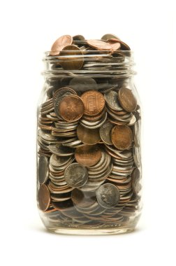Glass jar overflowing with American coins clipart