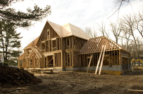 stock image McMansion type house under construction in framing phase