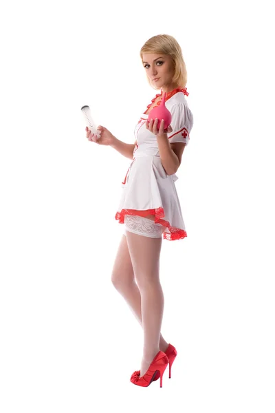 Sexy giovane infermiera con clistere e una siringa in mano — Foto Stock