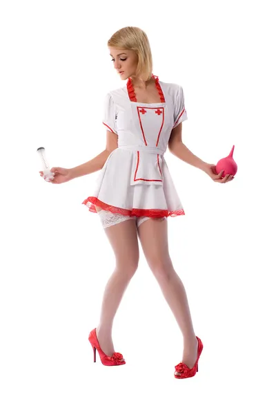 stock image Sexy young nurse with enema and a syringe in his hand