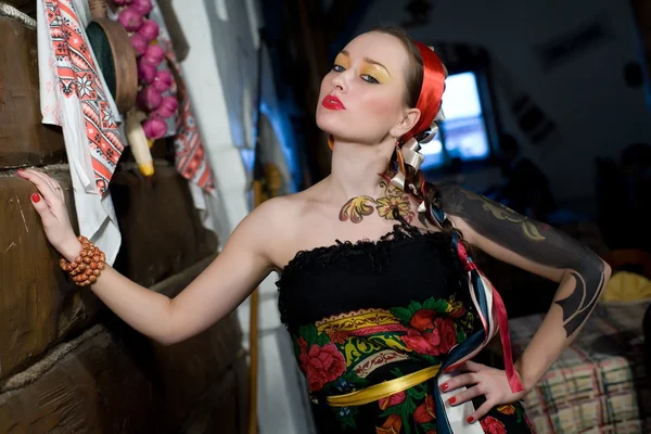 stock image Beautiful young woman with bright makeup and the pattern on the skin