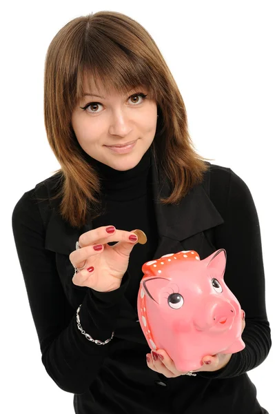 Girl with a piggybank — Stock Photo, Image