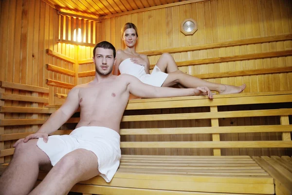 Happy young couple in sauna — Stock Photo, Image