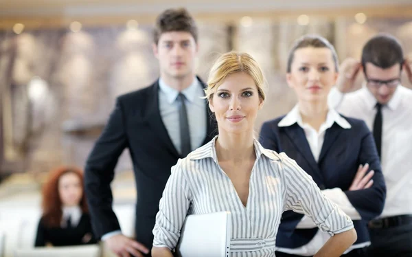 Business woman standing with her staff at conference — Stock Photo, Image