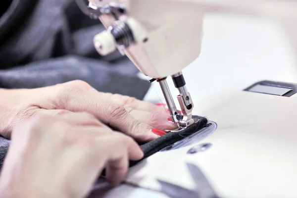 stock image Hands of Seamstress Using Sewing Machine