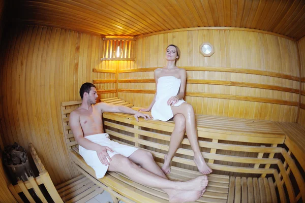 Happy young couple in sauna — Stock Photo, Image