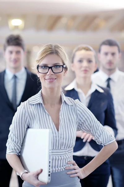Business woman standing with her staff at conference — Stock Photo, Image