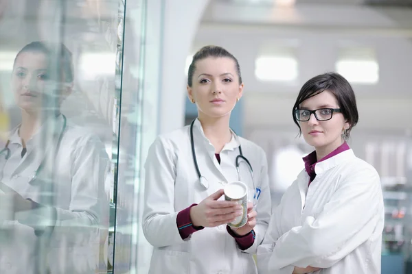 Team of pharmacist chemist woman in pharmacy drugstore — Stock Photo, Image