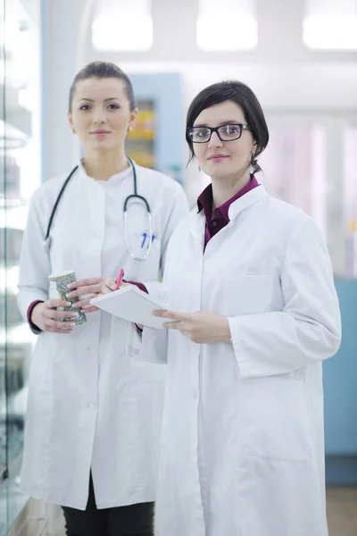 Team of pharmacist chemist woman in pharmacy drugstore — Stock Photo, Image