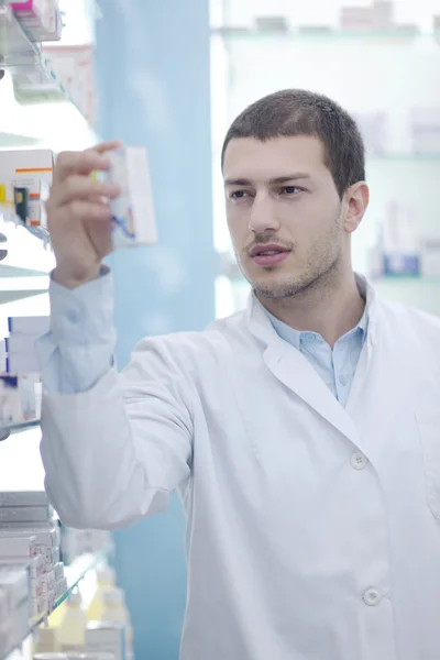 Pharmacist chemist man in pharmacy drugstore — Stock Photo, Image