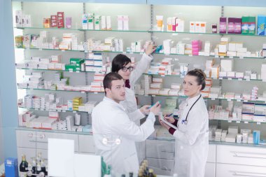 Pharmacist suggesting medical drug to buyer in pharmacy drugstore clipart