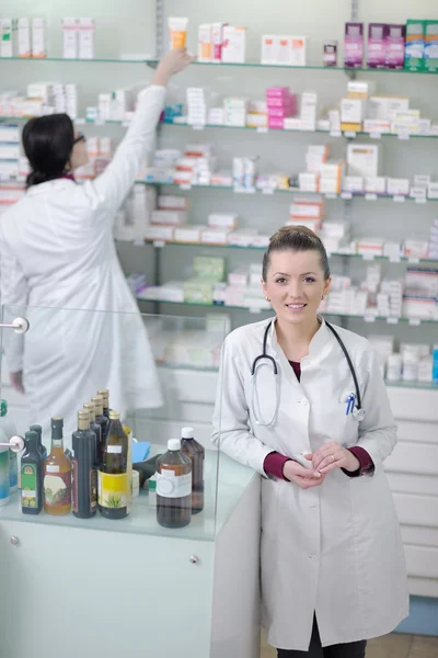 Team of pharmacist chemist woman in pharmacy drugstore — Stock Photo, Image