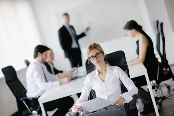 Business woman with her staff in background — Stock Photo, Image