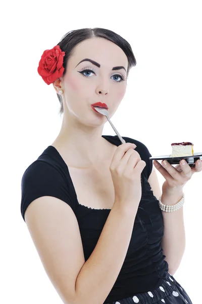 Hübsche junge glückliche Frau isst Kuchen — Stockfoto