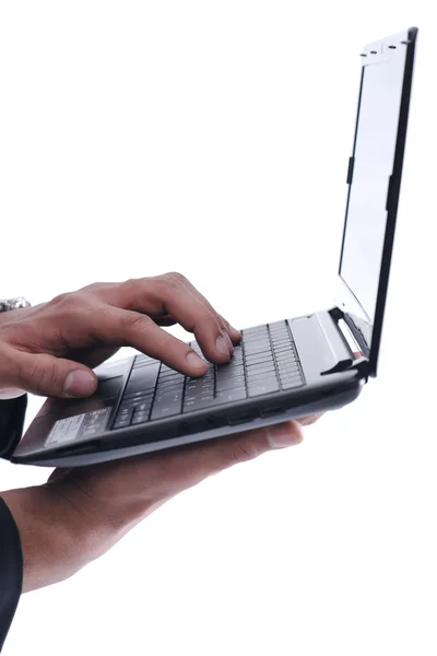 Biznes człowiek działa na mini-laptopa — Zdjęcie stockowe
