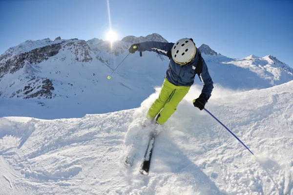Skiing on fresh snow at winter season at beautiful sunny day Royalty Free Stock Images