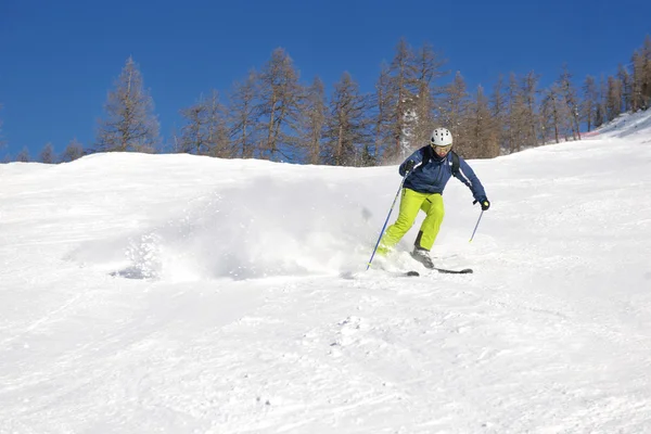 Skiing on fresh snow at winter season at beautiful sunny day — Stock Photo, Image