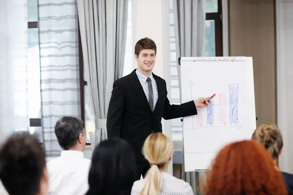 stock image Young business man giving a presentation on conference