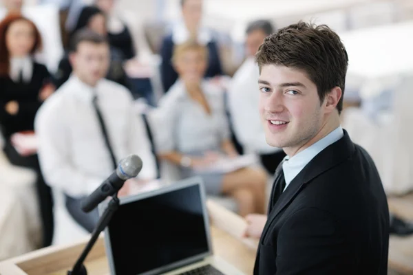 Young business man giving a presentation on conference — Stock Photo, Image