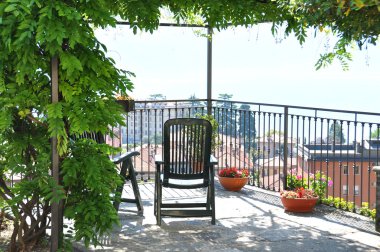 Two chairs overlooking lake Como, Italy clipart