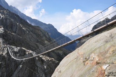 Trift Bridge, the longest 170m pedestrian-only suspension bridge clipart