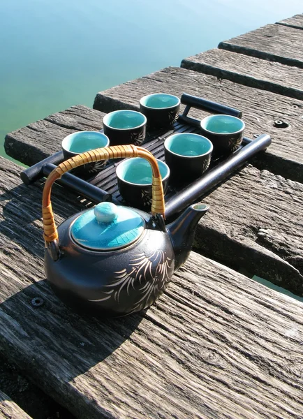Chinese tea set on a wooden jetty — Stockfoto