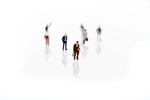Miniature man in one row — Stock Photo, Image