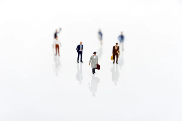 Miniature man in one row — Stock Photo, Image