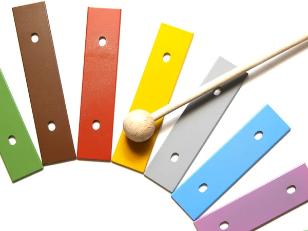 A colorful, wooden xylophone with mallet over white — Stock Photo, Image