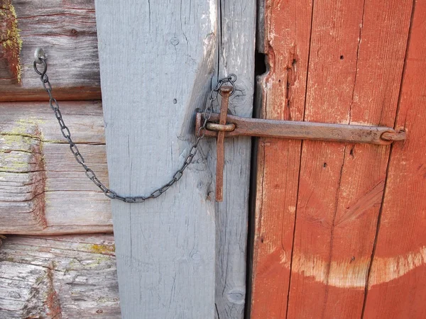 Locked old wooden door — Stock Photo, Image