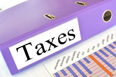 TAXES folder on a market report clipart