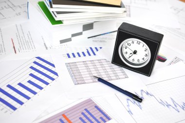 Clock, files and pen on a market report clipart