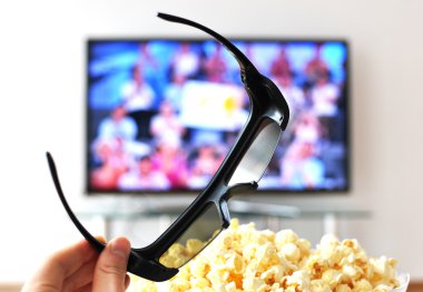 3D glasses against TV-set clipart