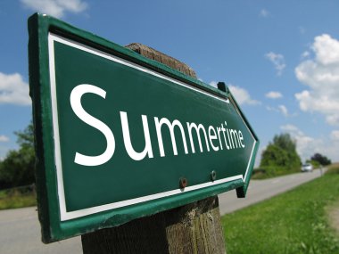 SUMMERTIME sign along a rural road clipart