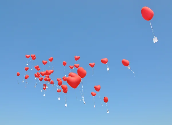 Czerwonych balonów z wiadomości w błękitne niebo — Zdjęcie stockowe