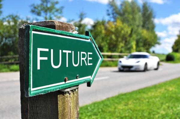 FUTURE arrow against a sportive car on the road — Stock Photo, Image