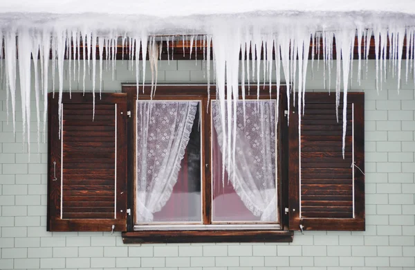 stock image Icicles against a window