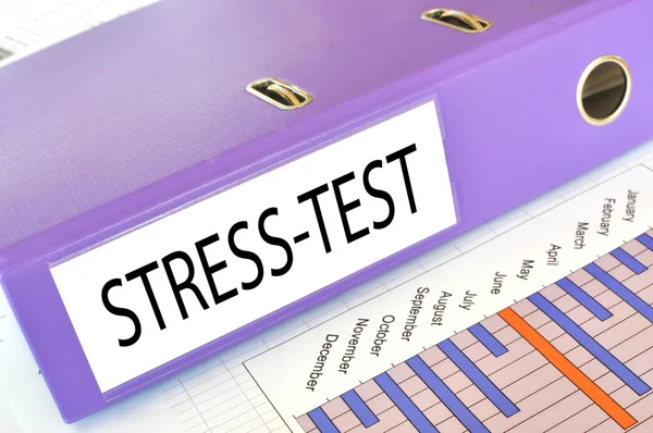 STRESS-TEST folder on a market report — Stock Photo, Image