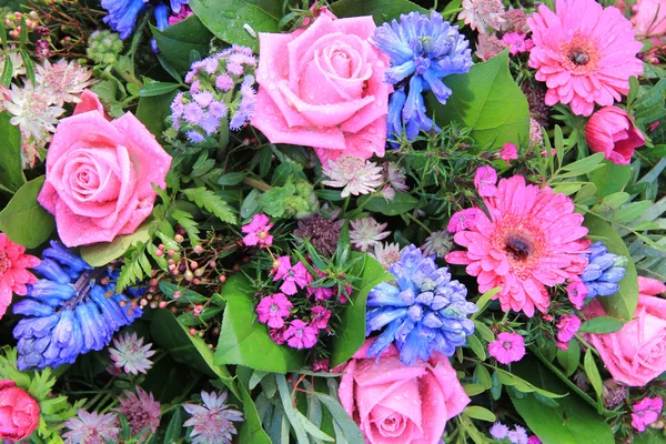 Mixed floral arrangement after rain shower — Stock Photo, Image