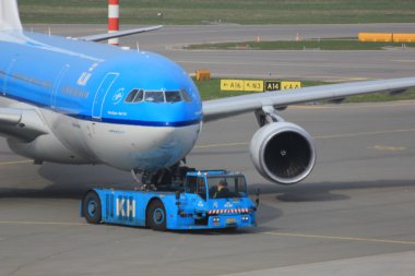 March, 24th Amsterdam Schiphol Airport Plane pushed back from ga clipart