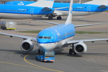 March, 24th Amsterdam Schiphol Airport Plane pushed back from ga clipart