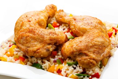 Roasted chicken legs, rice and vegetables clipart