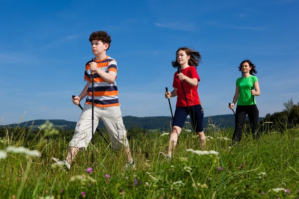 Nordic walking - active family outdoor — Stock Photo, Image